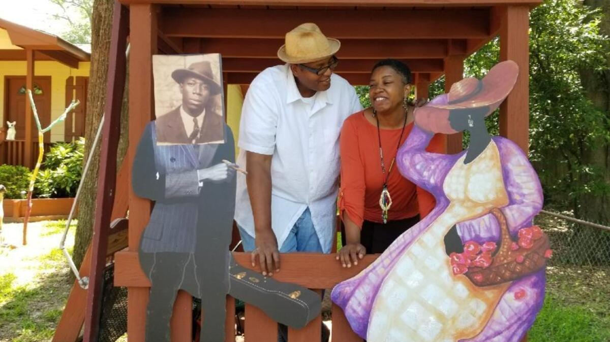 Columbus artists Najee and Seteria Dorsey spend time in their backyard on 18th Avenue with life-size versions of “Garden Art for the Soul” pieces that have gone viral on Facebook.