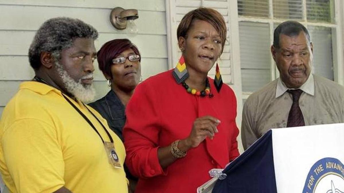 NAACP President Tonza Thomas leads press conference.
