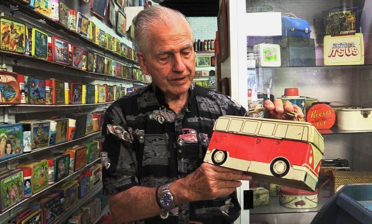 Allen Woodall shows one of the many lunchboxes he has on display at the Lunchbox Museum, located on Hamilton Road in Columbus.