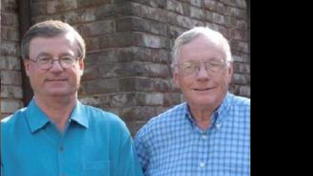 Auburn professor James Hansen, left, with Neil Armstrong in front of his Cincinnati home in 2005. 