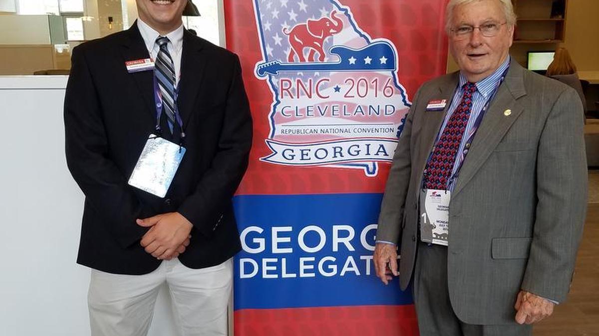 Tanner Goldsmith, left, and Alton Russell of Columbus, part of the Georgia delegation at the Republican National Convention, pose for a photo at Quicken Loans Arena in Cleveland.