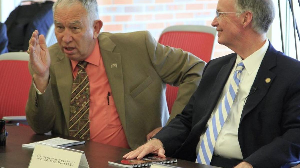 Alabama Gov. Robert Bentley,right, listens to David White, Troy University vice chancellor for the Phenix City campus, during Bentley's visit to Troy's Phenix City campus Thursday as part of Phenix City's 2nd Annual Governor's Day.