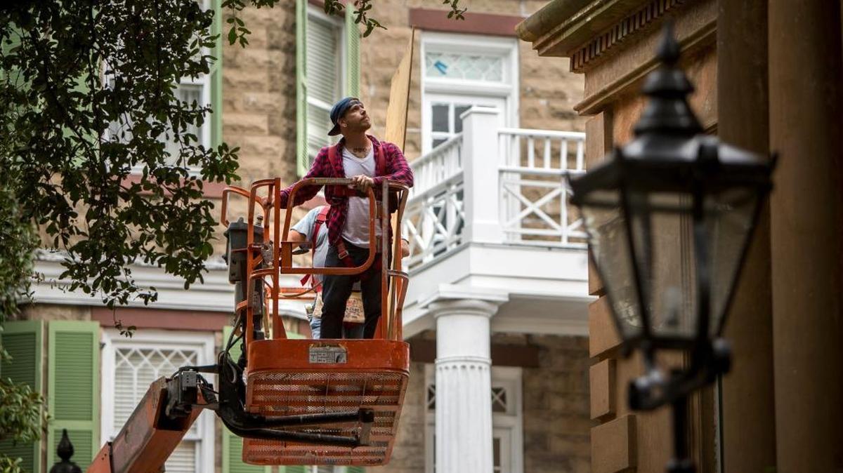 Nathan Ecker of Landmark Preservation uses a lift to place plywood over the windows of the Historic Owen-Thomas house during storm preparations for Hurricane Matthew, Thursday, Oct. 6, 2016, in Savannah, Ga. The Owens-Thomas house is one of the best preserved structures in the Landmark Historic District.