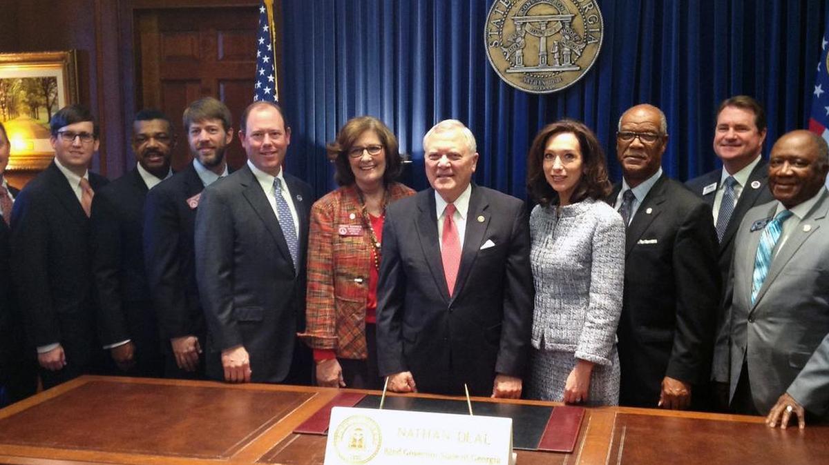 Part of the Columbus delegation with Gov. Nathan Deal, from left, Chamber Governmental Affairs Committee Chairman Joseph Brannan, Rep. John Pezold, Chamber Chairman Billy Blanchard, Rep. Debbie Buckner, Deal, Mayor Teresa Tomlinson, Rep. Calvin Smyre, Chamber President Brian Anderson and Sen. Ed Habison