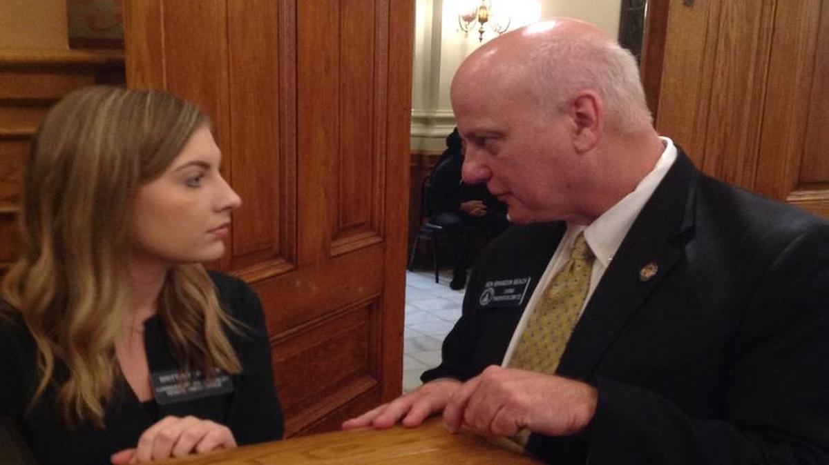 Sen. Brandon Beach, R-Alpharetta, speaks with a Senate staff member Thursday morning the Senate chambers.