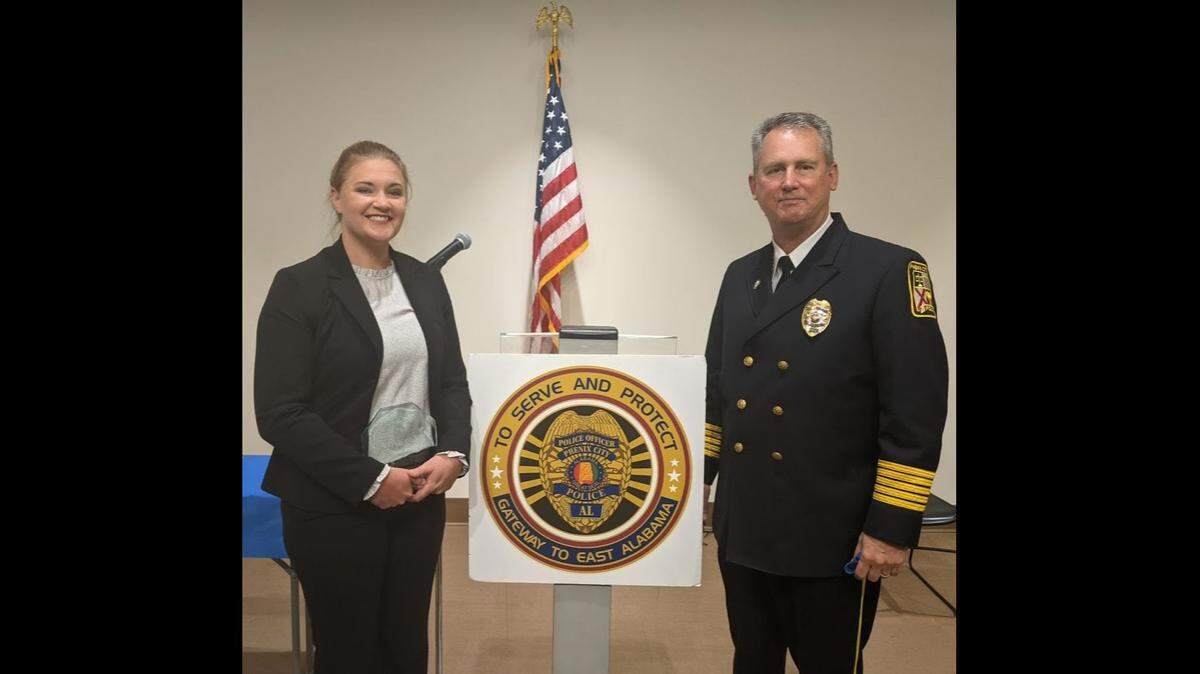 Sgt Kristina Anglin, left, with Phenix City Police Chief Ray Smith, right. Anglin was named the 2020 CrimeStoppers Officer of the Year.