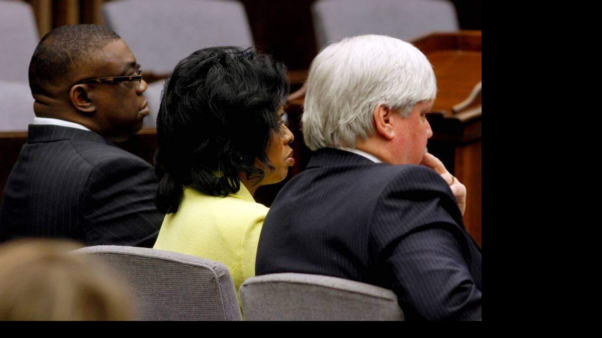 Marshal Greg Countryman, left, and Municipal Court Clerk Vivian Creighton Bishop sit with one of their attorneys in court earlier this year.