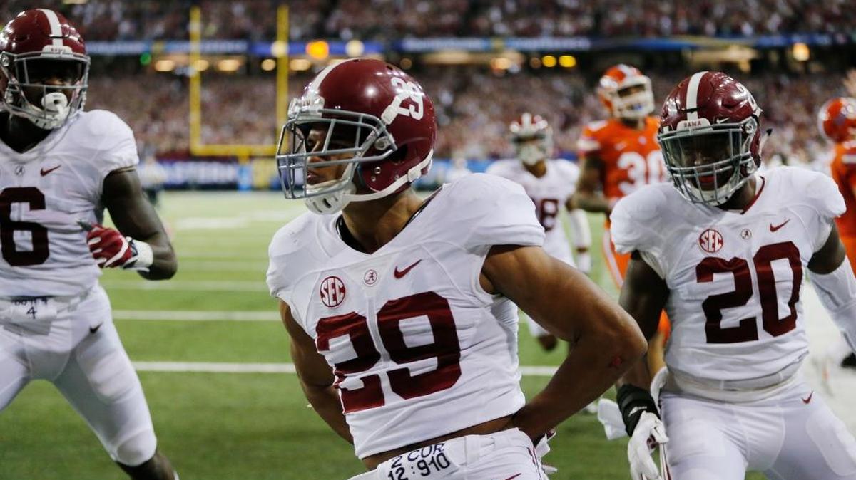Alabama defensive back Minkah Fitzpatrick, center, celebrates his touchdown during the first half of the Southeastern Conference championship game against Florida on Dec. 3 in Atlanta