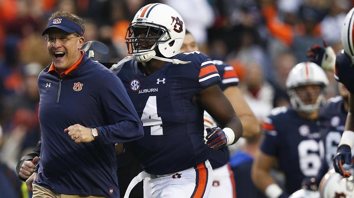 Auburn head coach Gus Malzahn runs off the field Nov. 11 after the first half of a game against Georgia in Auburn, Ala. Just three weeks after Auburn romped to a 23-point victory, the No. 4 Tigers face a rematch against No. 6 Georgia.