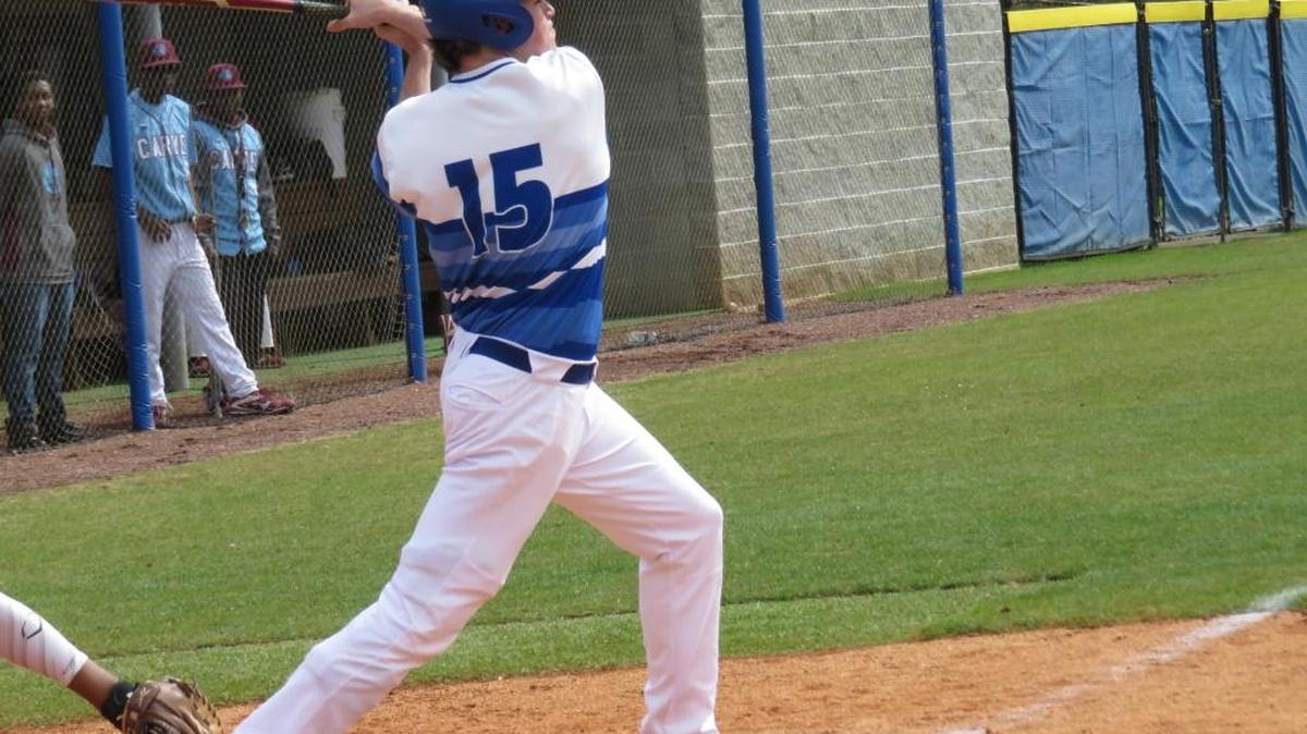 Brookstone left fielder Daniel Amos delivers a double in the sixth inning of the Cougars’ 9-0 victory over Carver on Saturday.