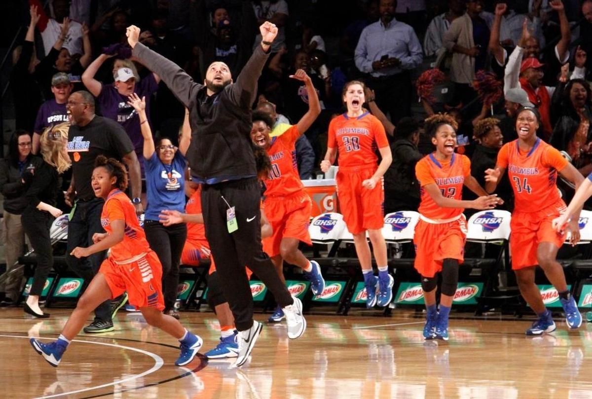 Columbus High head coach Joe Cherrone leaps into the air as the Lady Blue Devils win the GHSA Class AAAA state basketball championship 68-67 in overtime at the McCamish Pavillion at Georgia Tech.
