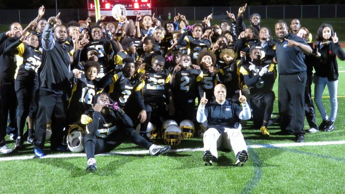 The Fort Middle School Patriots celebrate their championship after defeating Richards Middle School 20-6 on Thursday, November 9, 2017