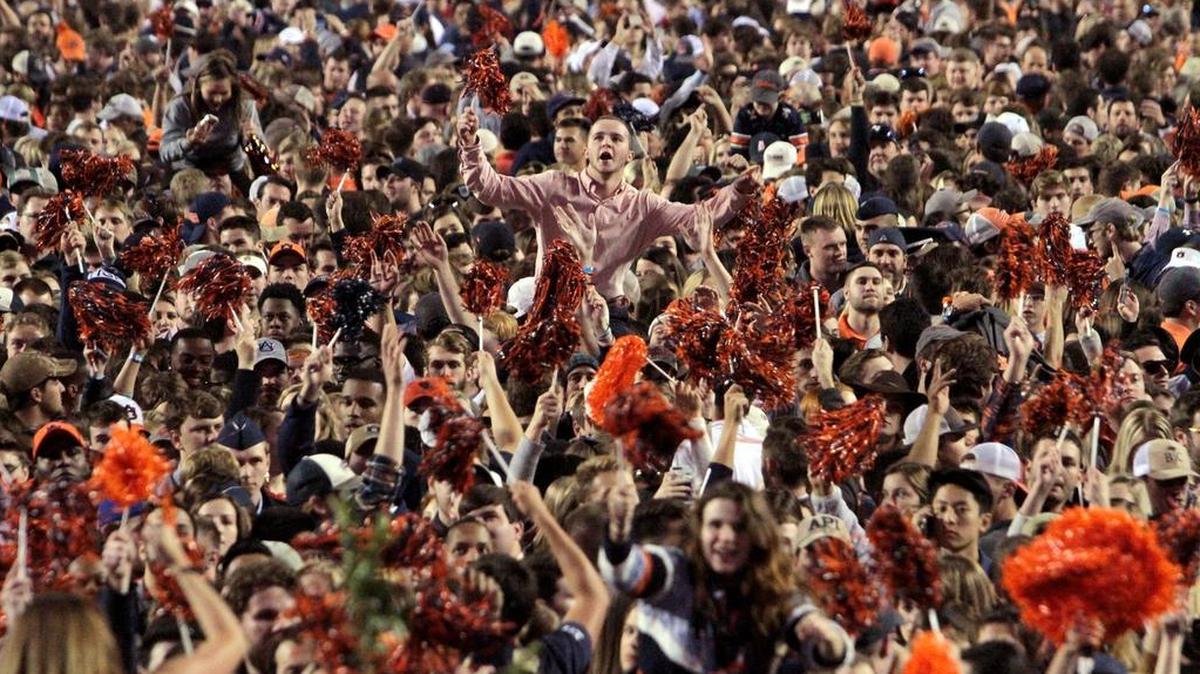 Students storm the field after Auburn upset Alabama 26-14 in the Iron Bowl Nov. 18 at Jordan-Hare Stadium.