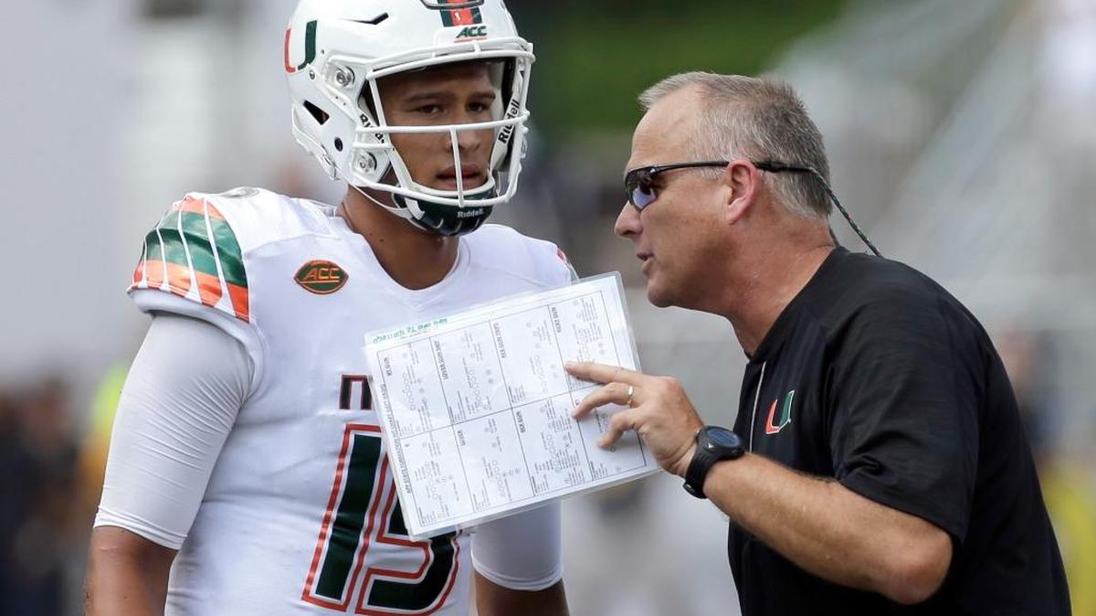 Miami head coach Mark Richt, right, talks with quarterback Brad Kaaya (15) during the second half of a game against Appalachian State last month.