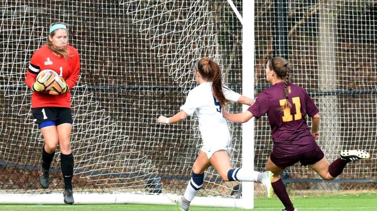 CSU's Maylyn Parsons blocks the shot of Armstrong's Erica Laurens with CSU's Kristy Gash defending against Erica Laurens in the 2nd half of the game Sunday after during the second-round match in the NCAA Division II Southeast Regional November 13, 2016