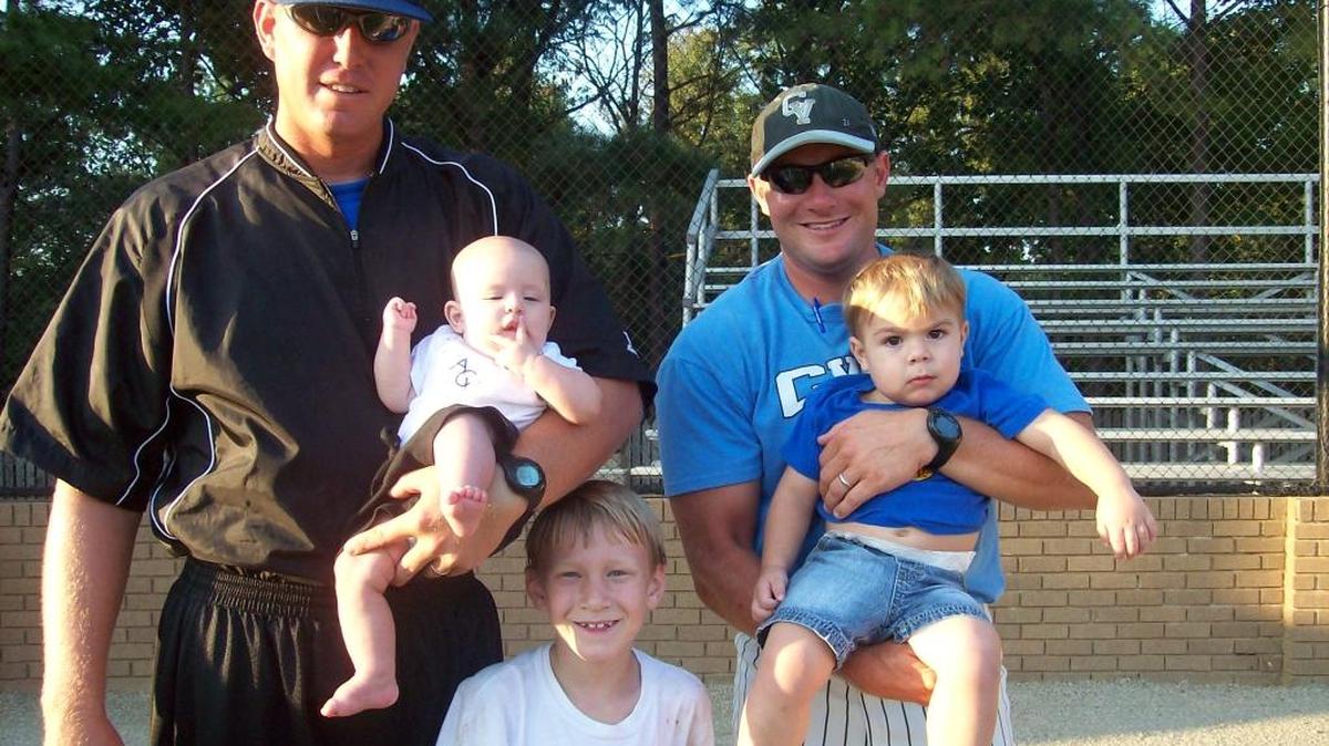 CVCC baseball coach Adam Thomas, right, and Darton State coach Scot Hemmings pose for a family photo. Hemmings is holding his daughter Addie. Thomas is holding his and Hemmings’ nephew Sims. Pictured in the middle is Thomas’ son Owen.