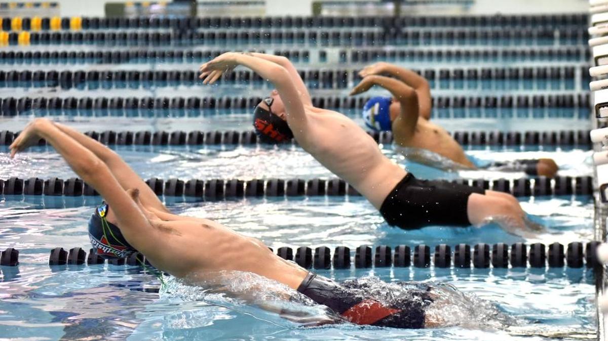 Northside’s Mason Boykin, Hardaway’s Gabriel Salinas and Americus-Sumter’s Carlos Virgen start the boys 200-yard medley relay at the 2017 Regional Championships on Tuesday at the Columbus Aquatics Center.