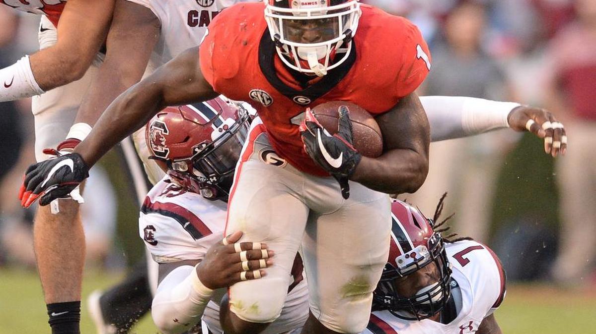 Georgia’s Sony Michel breaks a tackle against South Carolina Nov. 4 at Sanford Stadium. He finished the game with 81 rushing yards.