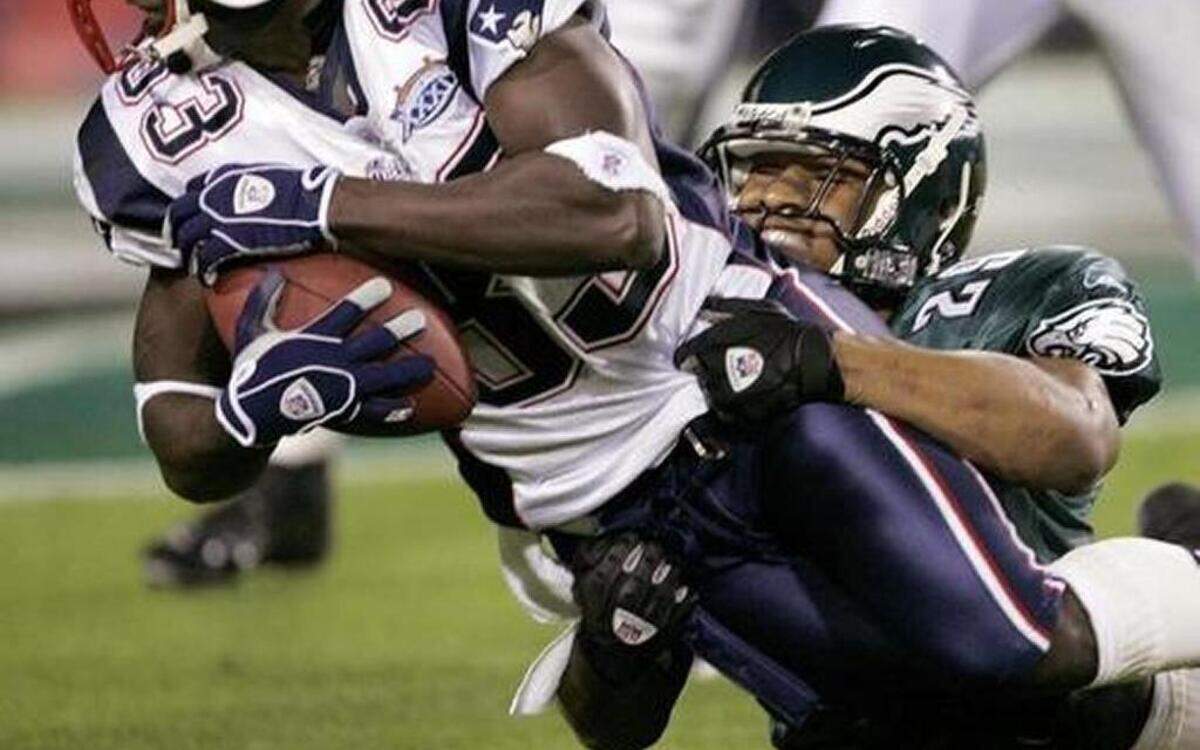 In this Feb. 6, 2005, file photo, New England receiver Deion Branch is tackled by Philadelphia’s Roderick Hood in Super Bowl XXXIX in Jacksonville, Fla. Hood is one of 13 Columbus-area players who have participated in the Super Bowl.