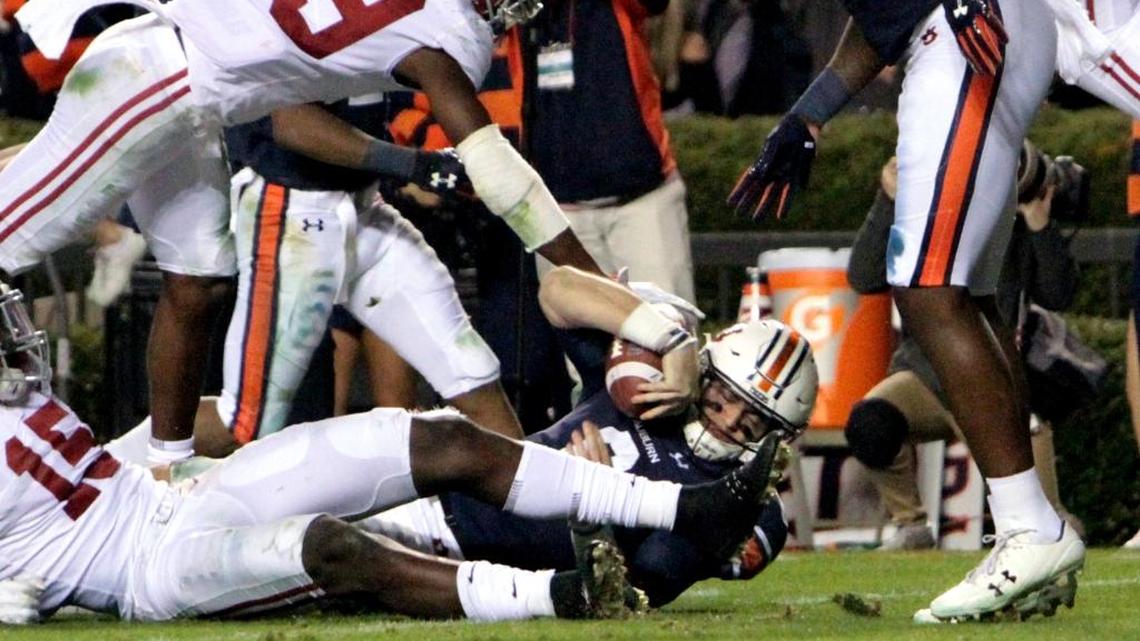 Auburn quarterback Jarrett Stidham scores in the fourth quarter to give the Tigers a 26-14 lead and the win over Alabama Saturday, November 25, 2017 at Jordan-Hare Stadium.