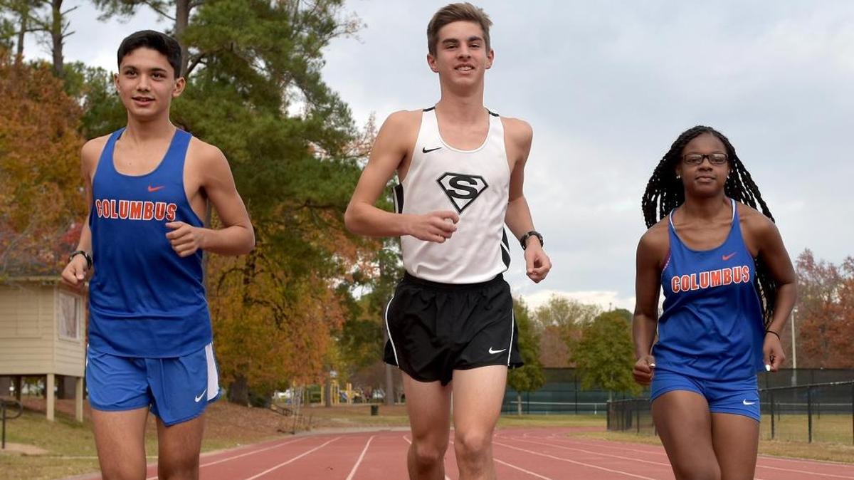 Smith Station’s Silas Franklin (middle) joined by fellow Boys Cross Country Runner of the Year Alex Salgado as well as Girls Cross Country Runner of the Year Heaven Allen