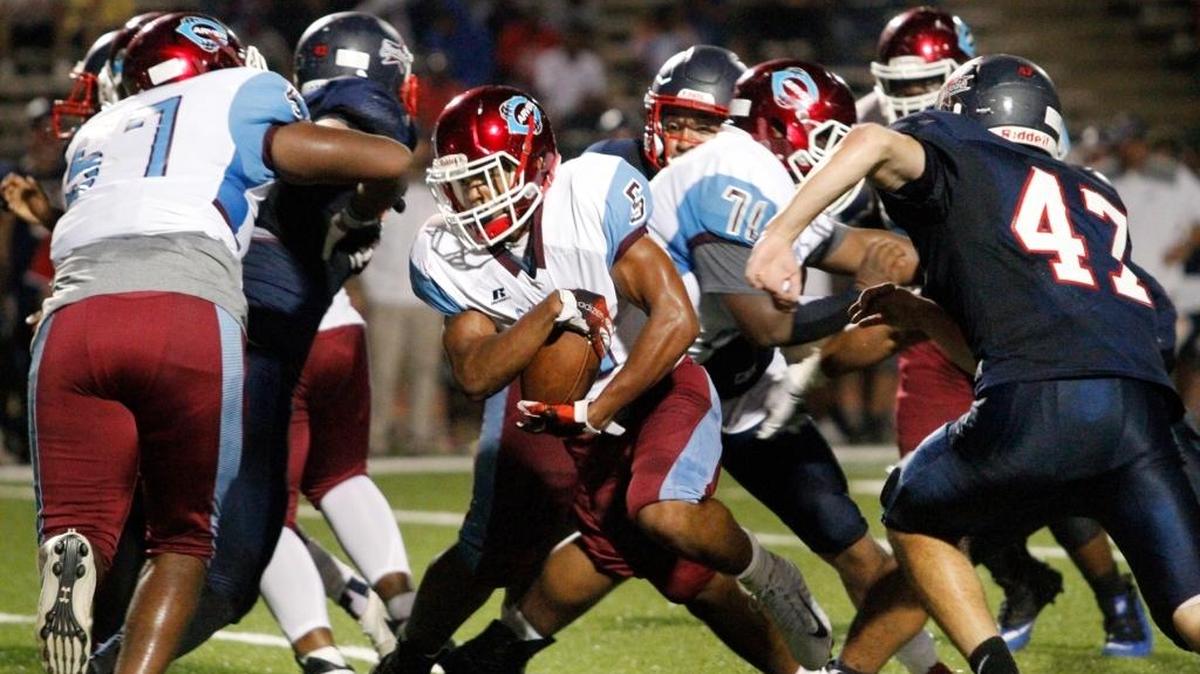 Carver High running back Justin Swain rushes against Northside High at Kinnett Stadium Friday, September 15, 2017.