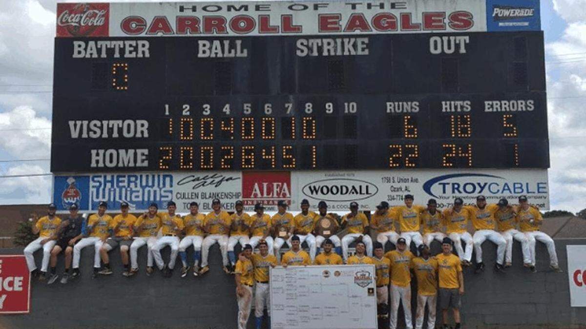 The CVCC baseball team poses underneath the scoreboard at Eagle Stadium in Ozark, Ala. CVCC beat Calhoun 22-6 to win its third straight ACCC championship.