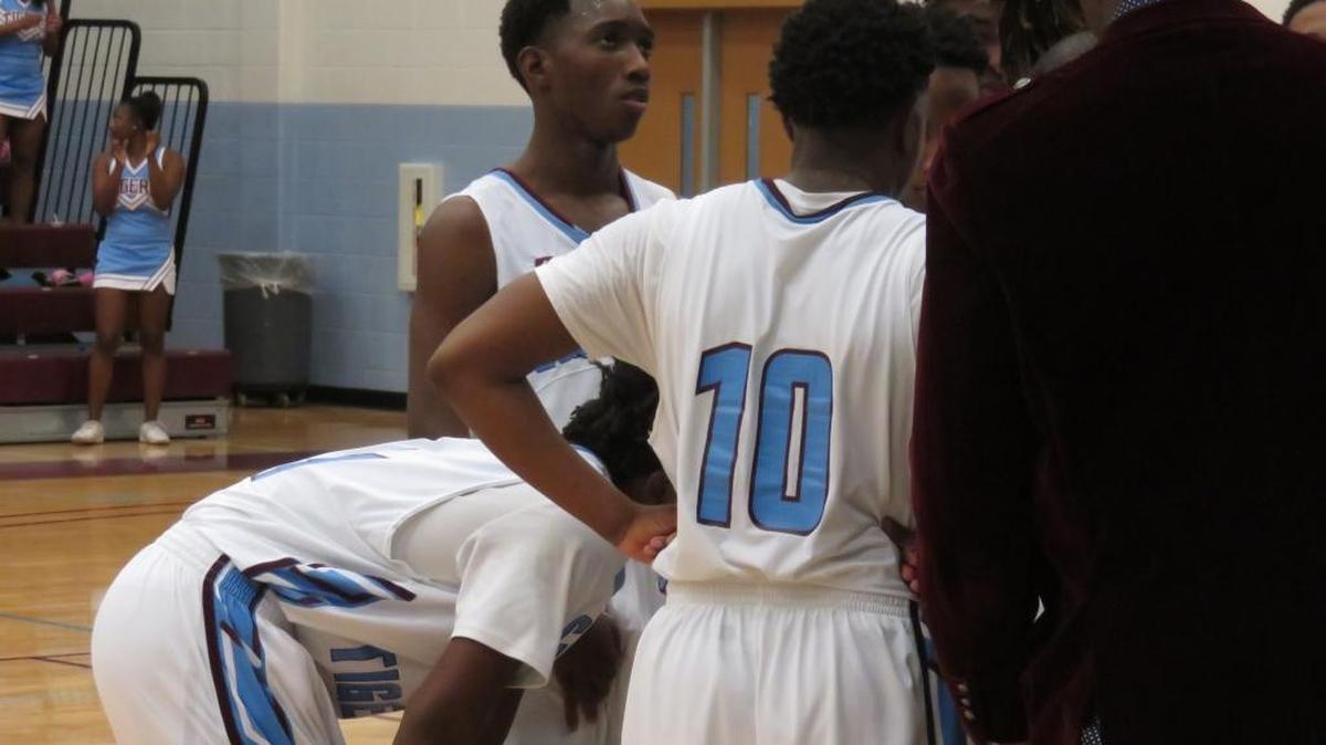 Rodney Battle listens in the huddle during Carver’s 96-76 victory over Burke County on February 18, 2017.