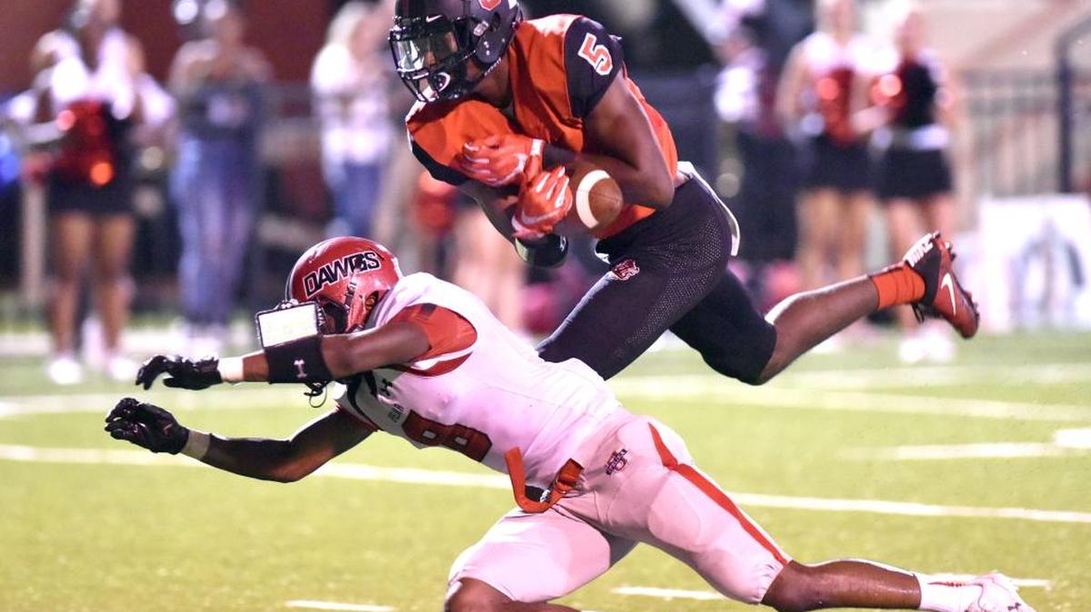 Central's Justyn Ross goes up and over Opelika's Justin Lewis for the pass reception and dive into the end zone for Central's 2nd touchdown of the night against Opelika Friday night, September 29, 2017.