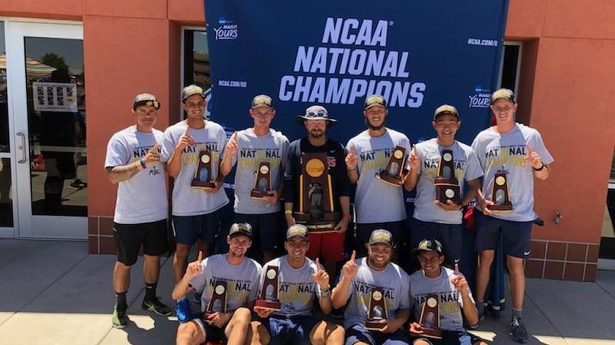 Coach Evan Isaacs and his Columbus State University men’s tennis team celebrate after winning the national championship.