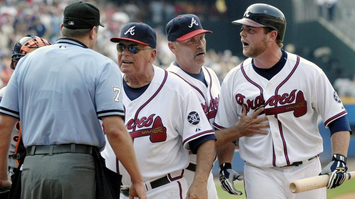 Atlanta Braves manager Bobby Cox, center left, argues after Braves' Brian McCann, right, was tossed for arguing a called third strike with home plate umpire Chad Fairchild, left, as Braves third base coach Brian Snitker holds back McCann during the ninth inning of a baseball game against the Detroit Tigers, Saturday, June 23, 2007, at Turner Field in Atlanta. Cox was also ejected, tying the record for ejections set by John McGraw