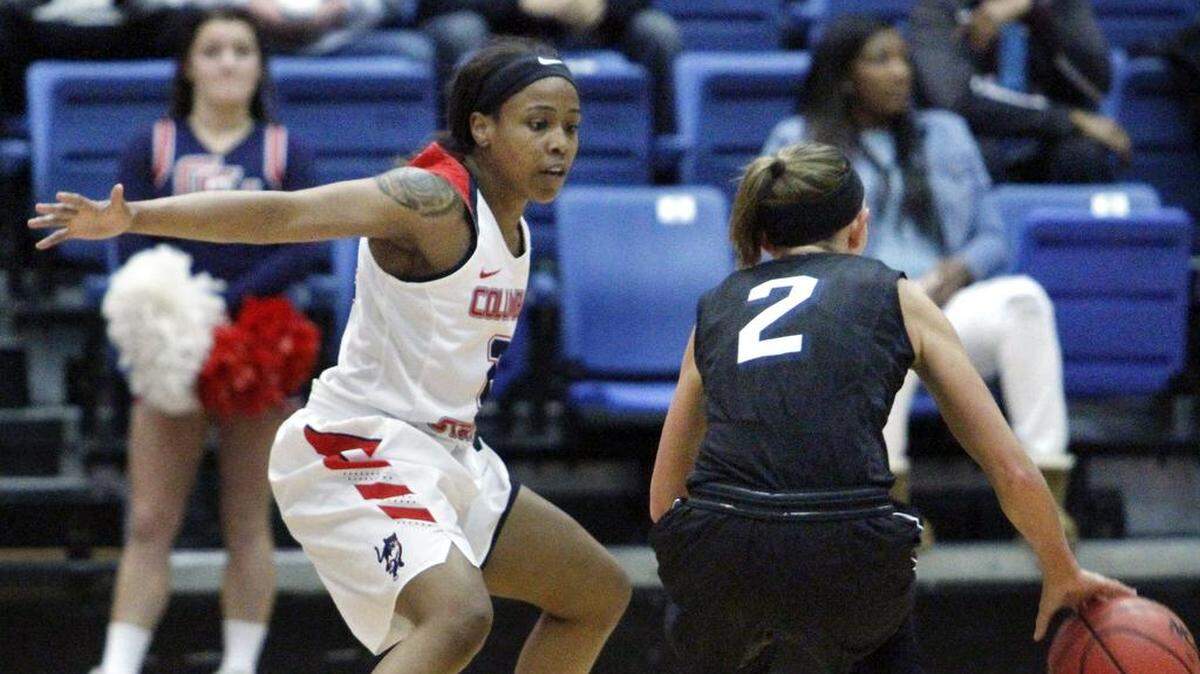 Columbus State University's Tatiana Wayne guards Lincoln Memorial's Karsen Sims in the NCAA Southeast Regional championship game in the Lumpkin Center.