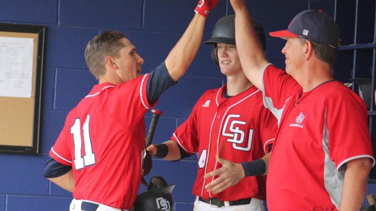 Columbus State’s Blake Edwards, left, high-fives coach Greg Appleton during a recent game.