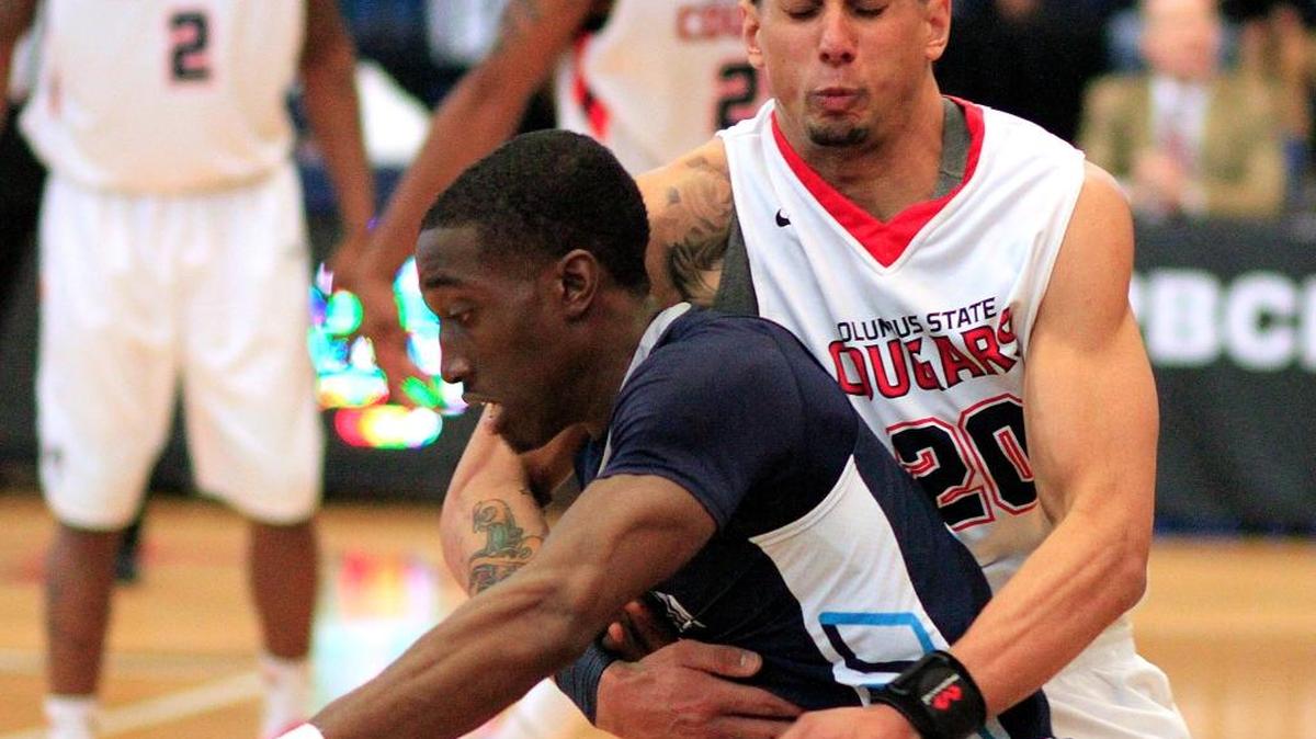Columbus State University’s Brent Jackson, right, fouls Augusta University’s Keshun Sherrill late in the second half Saturday afternoon during 25th Annual Peach Belt Conference Basketball Championships at Columbus State University’s Lumpkin Center. 03/05/16