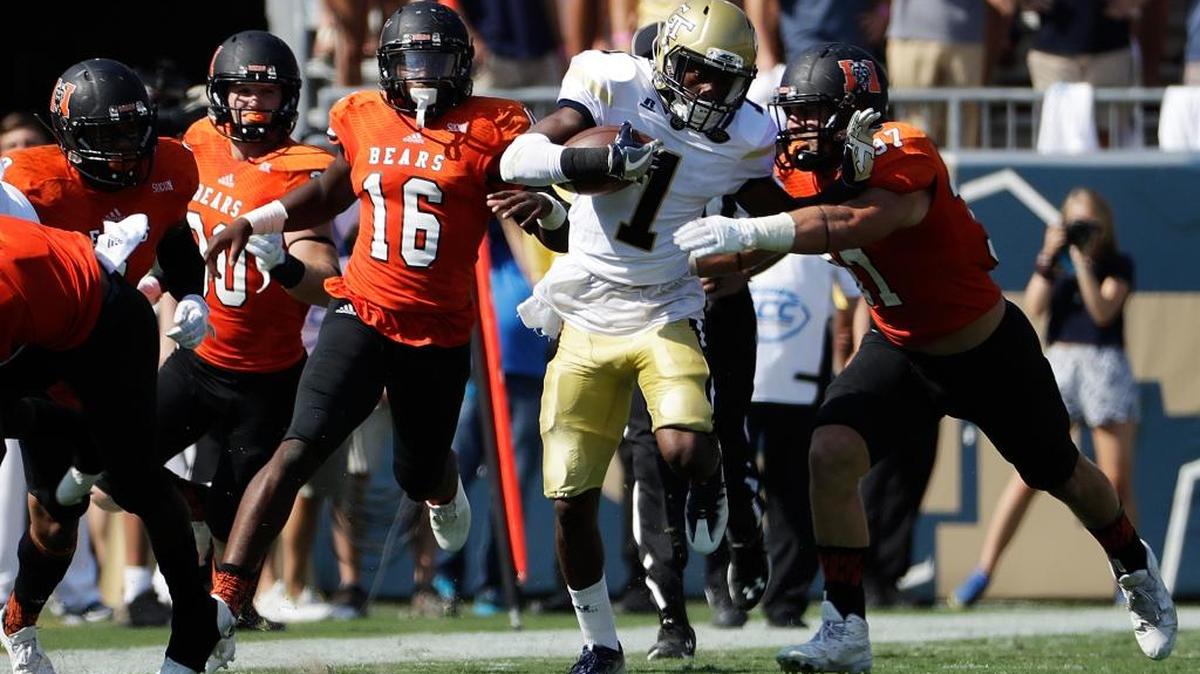 Georgia Tech’s Qua Searcy runs the ball against Mercer’s Tyler Ward in the first half Saturday in Atlanta.