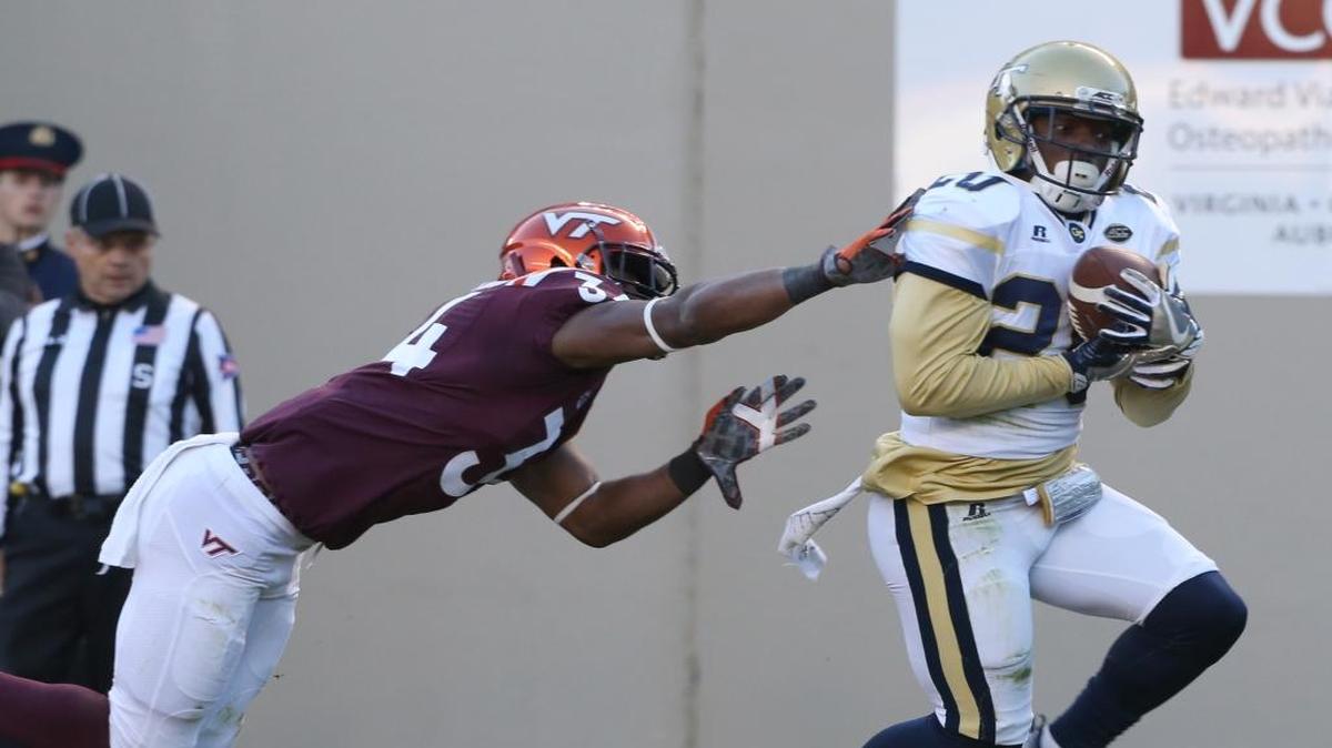 Georgia Tech safety Lawrence Austin, right, intercepts a pass in the endzone in front of Virginia Tech receiver Travon McMillian during the first half in Blacksburg, Va., on Saturday. Tech won 30-20.
