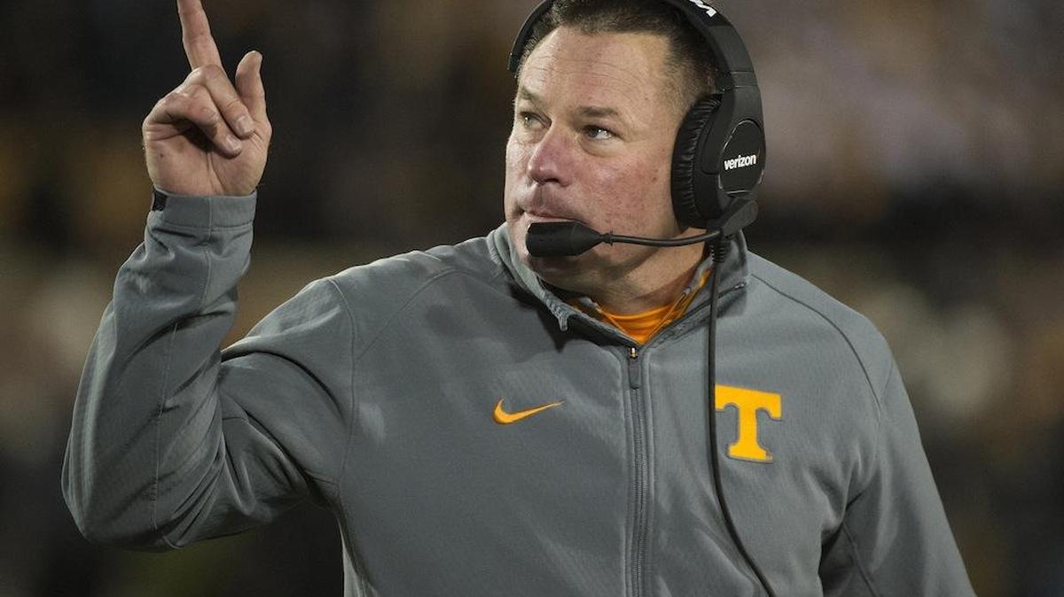 Tennessee head coach Butch Jones points to the scoreboard during the first quarter of an NCAA college football game against Missouri in Columbia, Mo.
