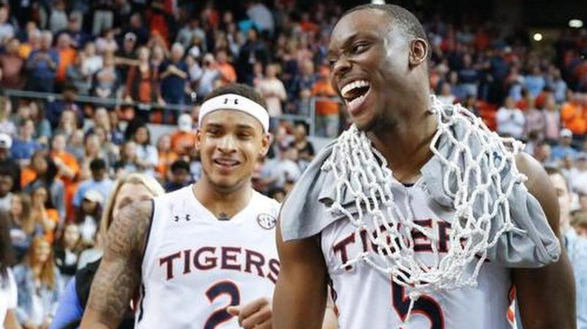 Auburn guard Mustapha Heron, right, wears a basketball net after an NCAA college basketball game against South Carolina on Saturday , March 3, 201 , in Auburn, Ala.