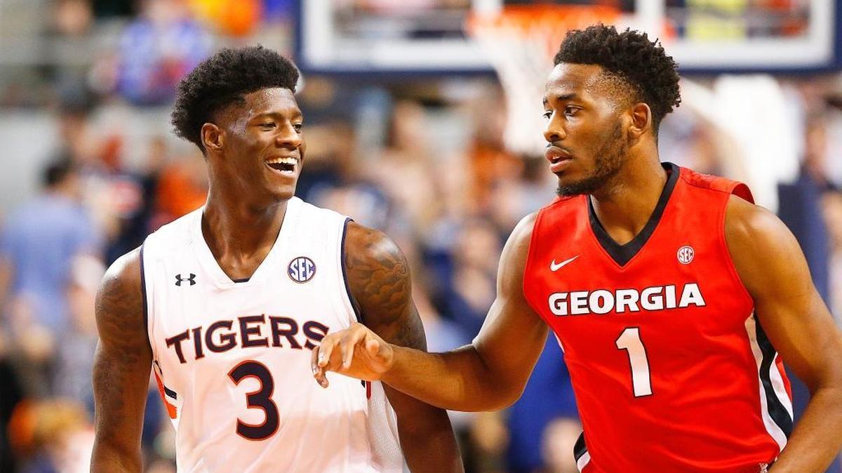 Auburn forward Danjel Purifoy smiles toward Georgia forward Yante Maten after Purifoy scored during their Dec. 29, 2016 game in Auburn, Ala.