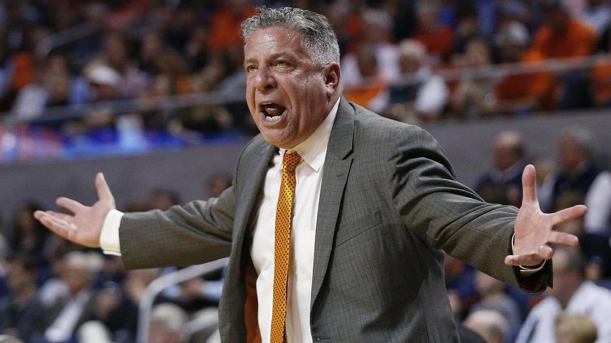 In this March 3, 2018, file photo, Auburn head coach Bruce Pearl reacts on the sidelines during the first half of an NCAA college basketball game against South Carolina, in Auburn, Ala.