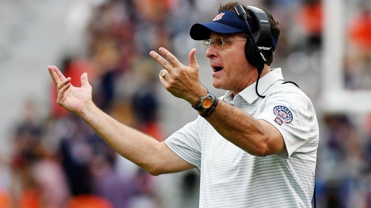 In this Oct. 7, 2017, file photo, Auburn head coach Gus Malzahn calls to players during the second half of an NCAA college football game against Mississippi in Auburn, Ala