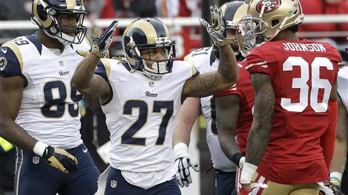 St. Louis Rams running back Tre Mason (27) celebrates after scoring on a touchdown run next to San Francisco 49ers defensive back Dontae Johnson (36) during the first half of an NFL football game in Santa Clara, Calif., Sunday, Jan. 3, 2016.