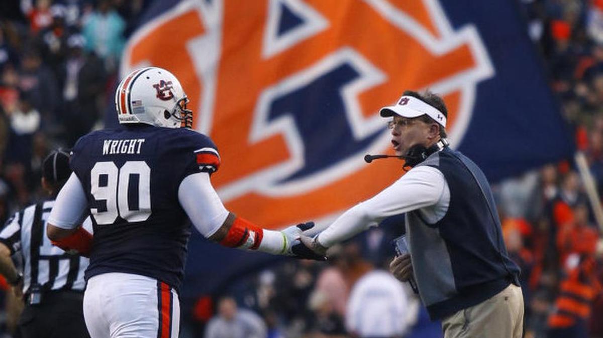 Auburn defensive lineman Gabe Wright runs to the sideline before the kick six against Alabama at Jordan-Hare Stadium in 2013.