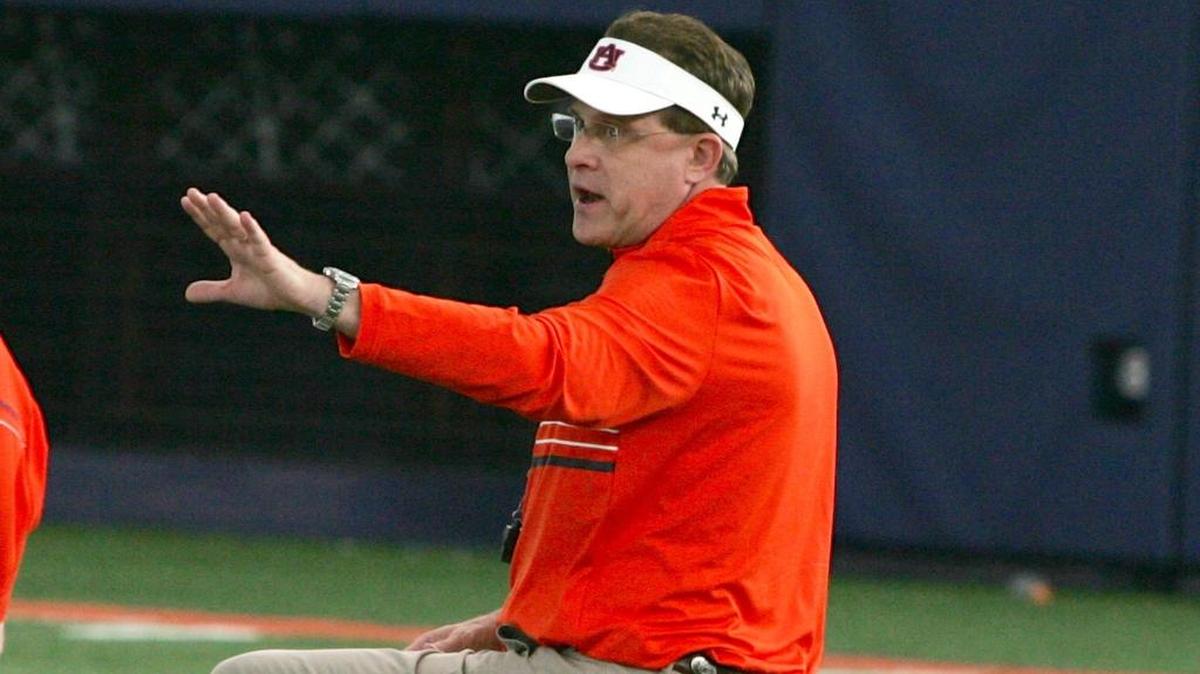 Auburn coach Gus Malzahn, right, talks to players during practice at the university's athletic complex Tuesday, March 8, 2016.