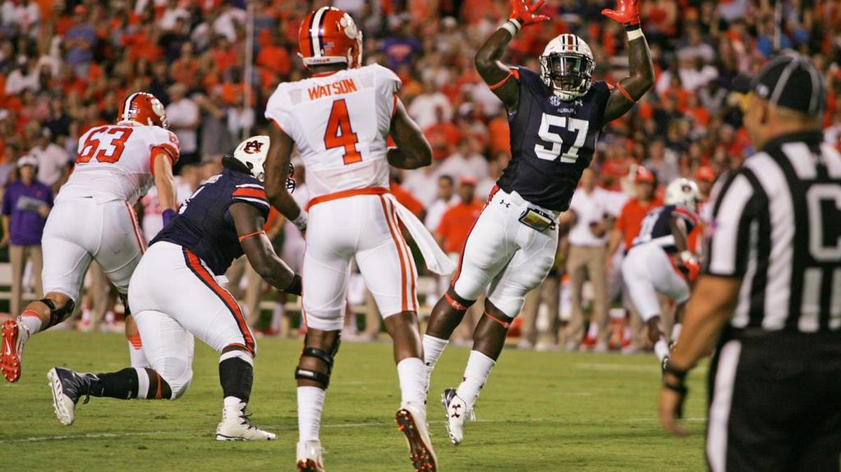Auburn linebacker Deshaun Davis leaps to get his hands on a pass thrown by Clemson quarterback Deshaun Watson Saturday, Sept. 3, 2016 at Jordan-Hare Stadium.