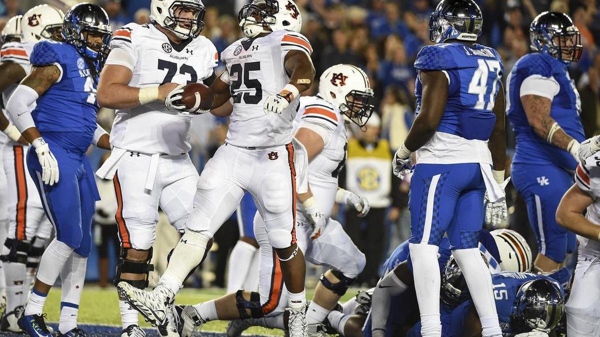 Auburn running back Peyton Barber, No. 25, celebrates a touchdown at Kentucky on Oct. 15, 2015.