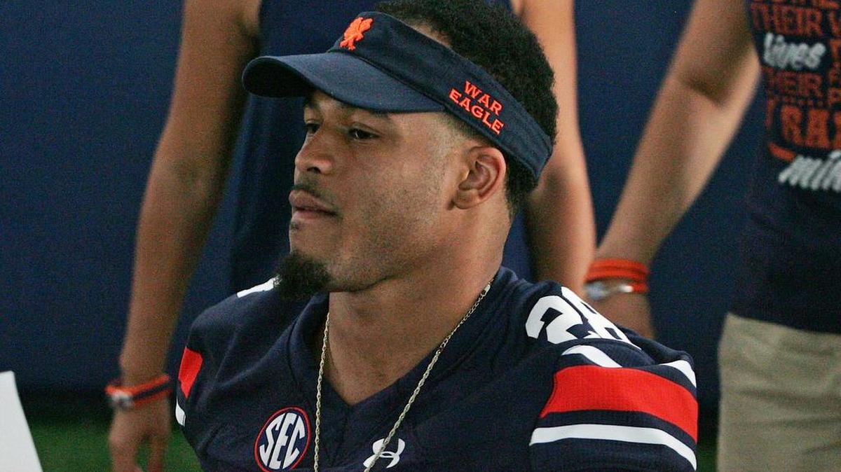 Auburn safety Tray Matthews visits with fans at the program's annual Fan Day on Sunday, August 14, 2016.
