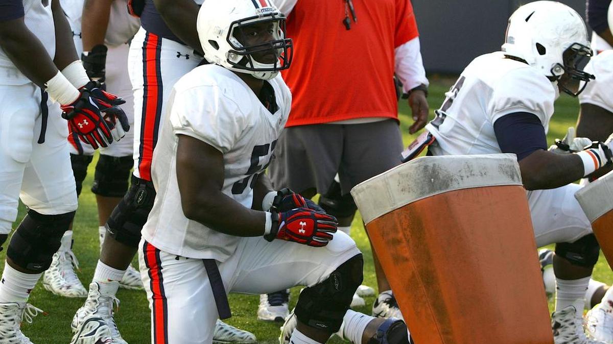 Auburn defensive lineman Carl Lawson runs drills at spring practice on Tuesday, March 8, 2016.