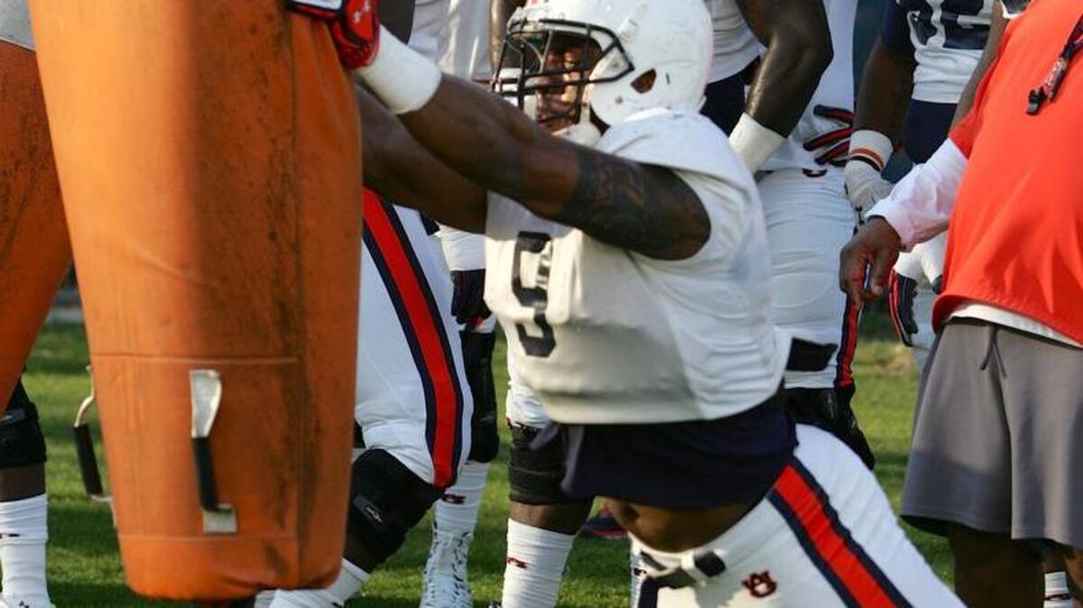 Auburn defensive lineman Byron Cowart runs drills during spring practice on March 8, 2016.