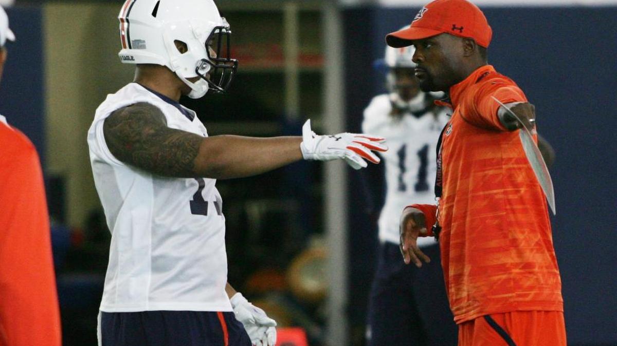 Auburn linebacker T.J. Neal gets direction from position coach Travis Williams on the second day of training camp on Thursday, Aug. 4, 2016 at the university's athletic complex.